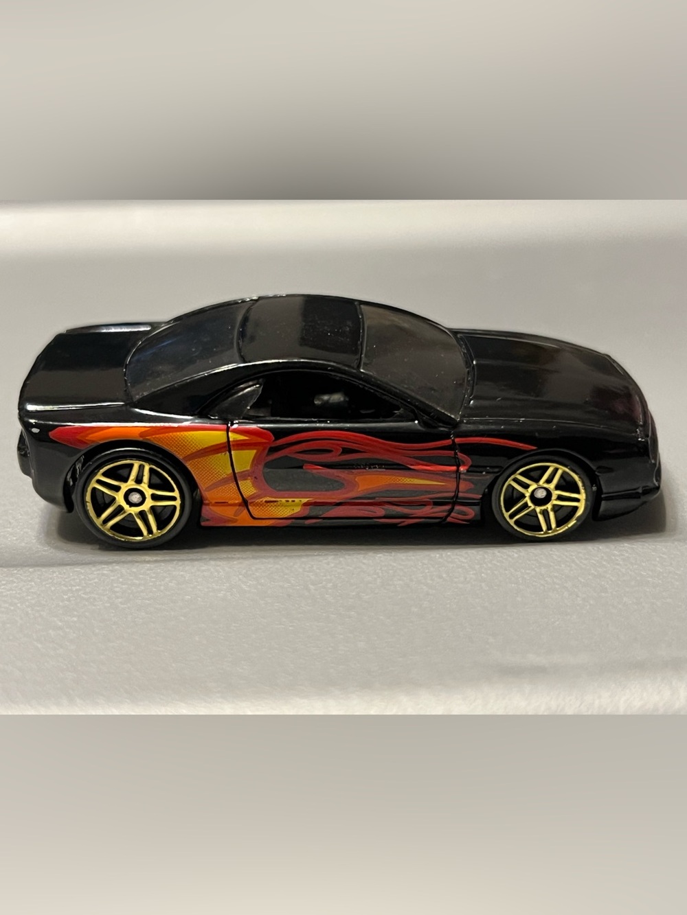 Hot Wheels Muscle Tone Car with Red and Orange Flame Graphics